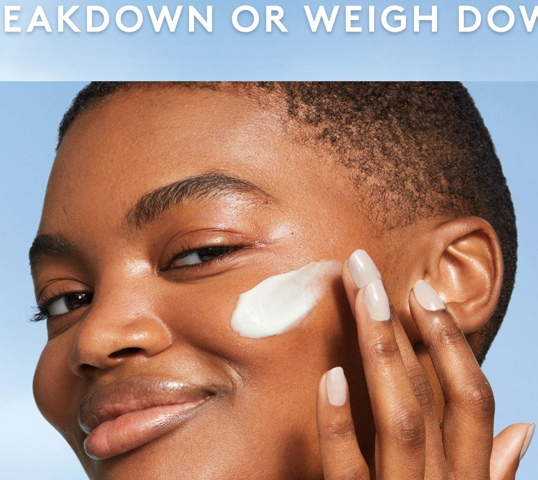 Model applying white face cream to their face