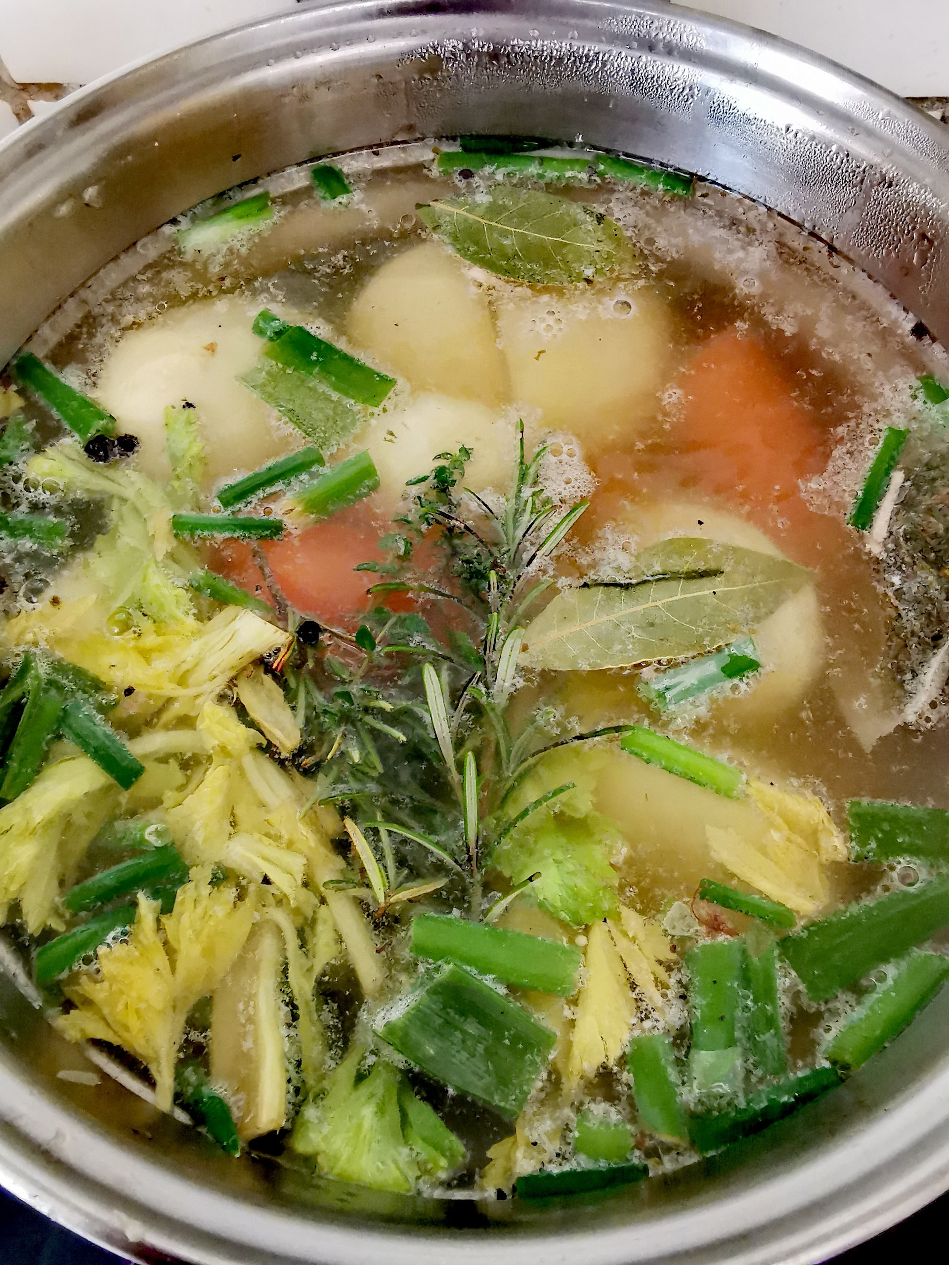 A pot of vegetable broth cooking