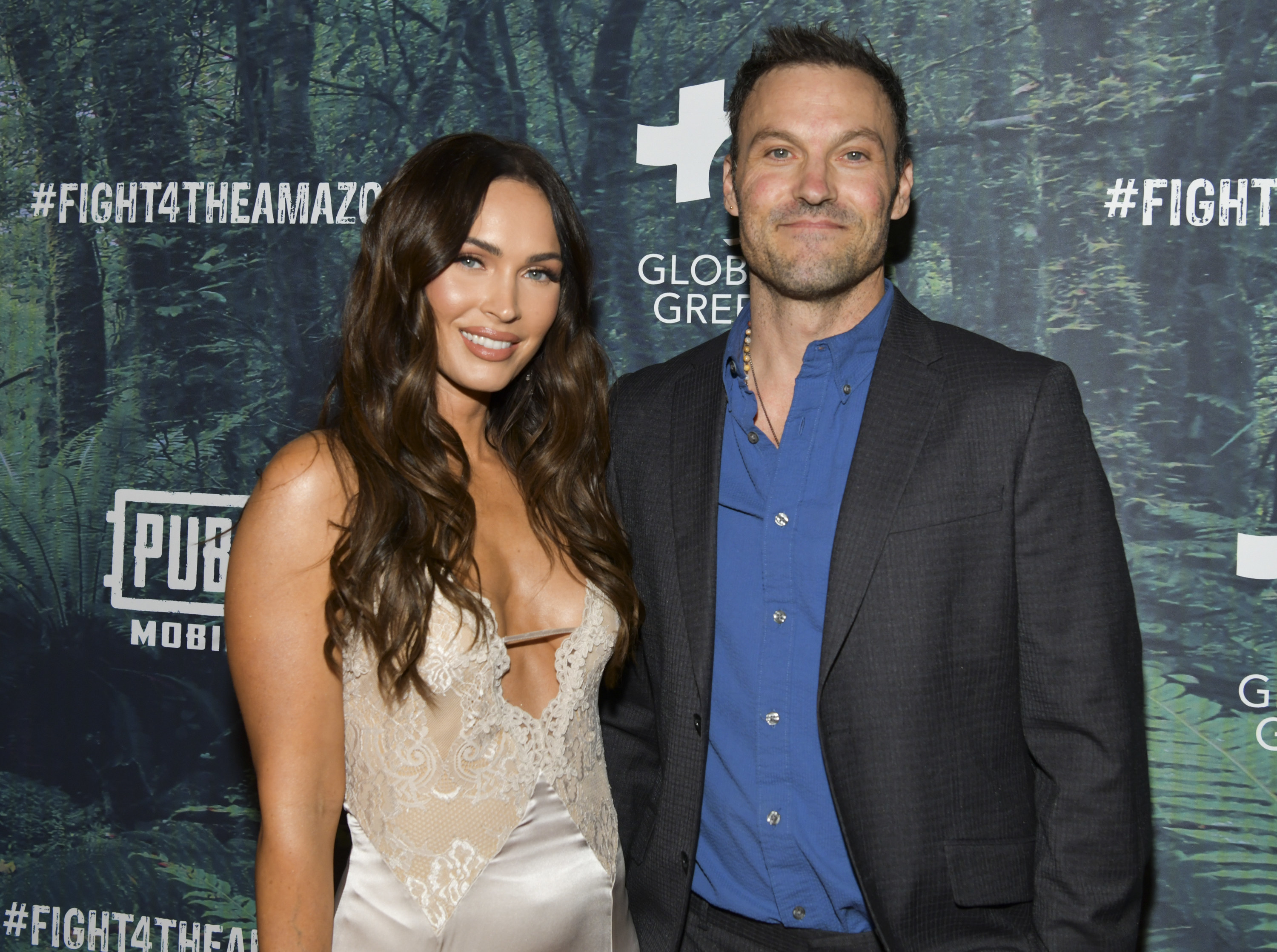 The former couple pose together for a photo at a red carpet event