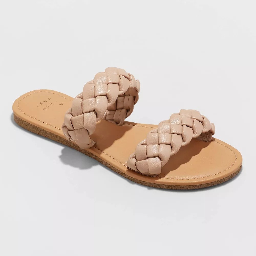 a slide sandal with tan braids