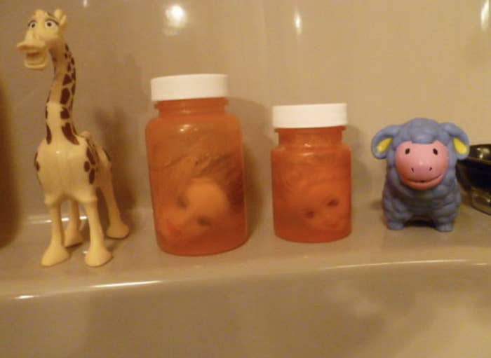 Doll heads in little jars