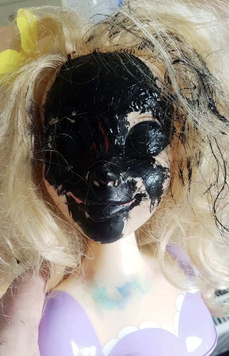 A doll that has a completely blackened face