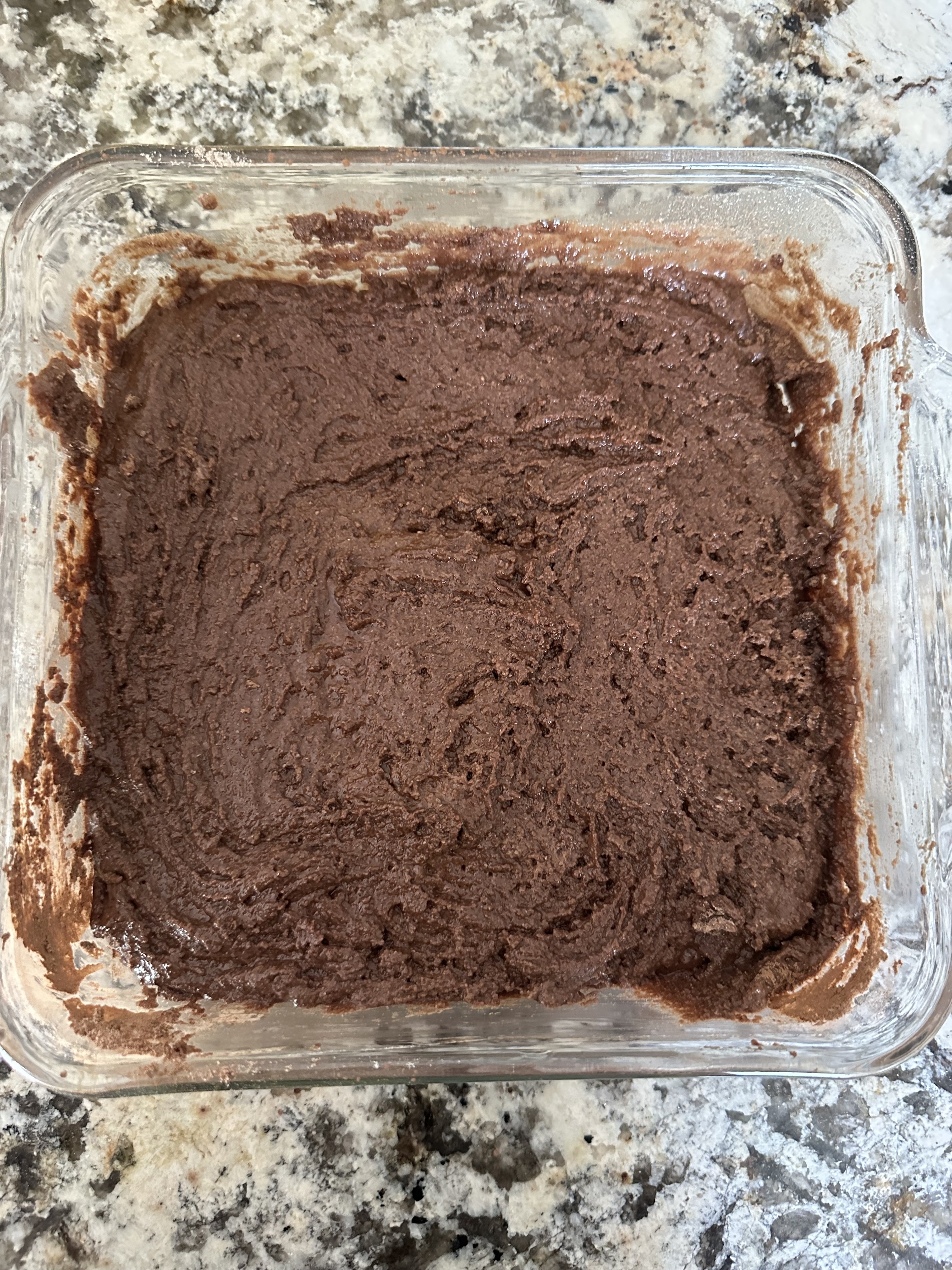 a cake ready to be baked in an oven
