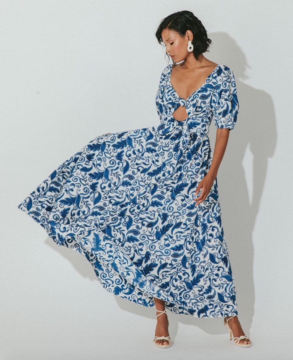 model wearing the blue and white print dress