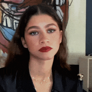 Zendaya nodding her head in agreement