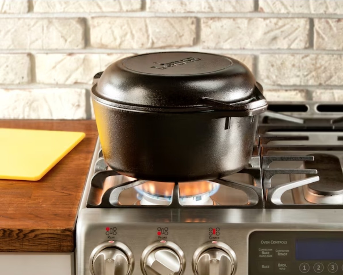 a black dutch oven over a heated stove