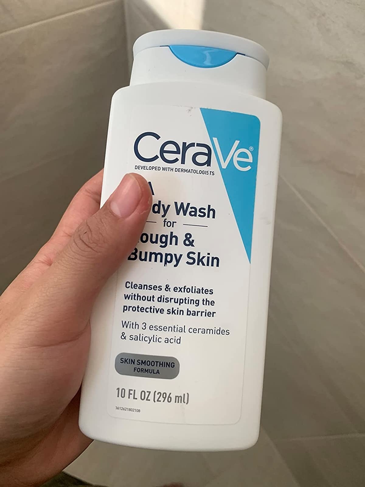 Reviewer holding the body wash