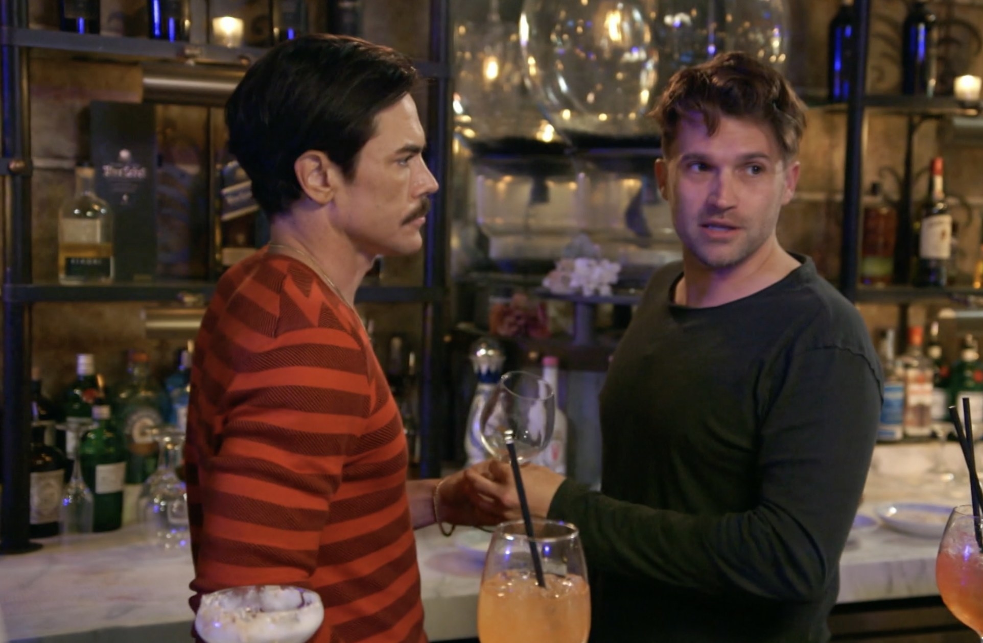 Sandoval and Schwartz making drinks behind the bar of TomTom