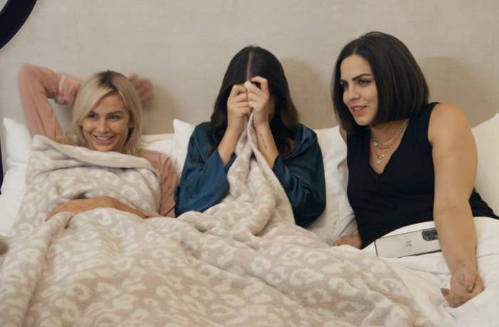 Lala, Kristina, and Katie lay in bed in their Las Vegas hotel room