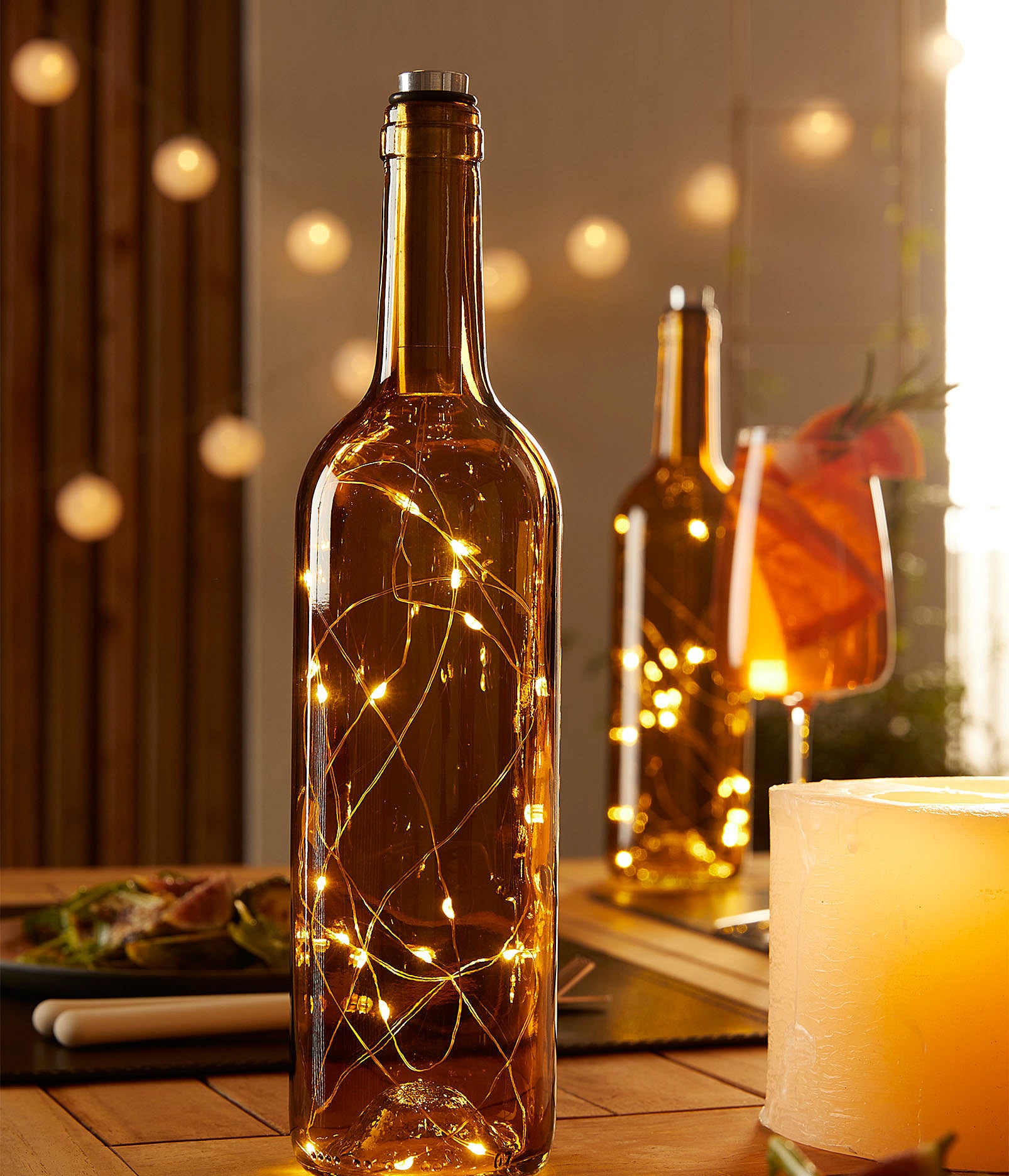 a glass bottle with fairy lights inside of it