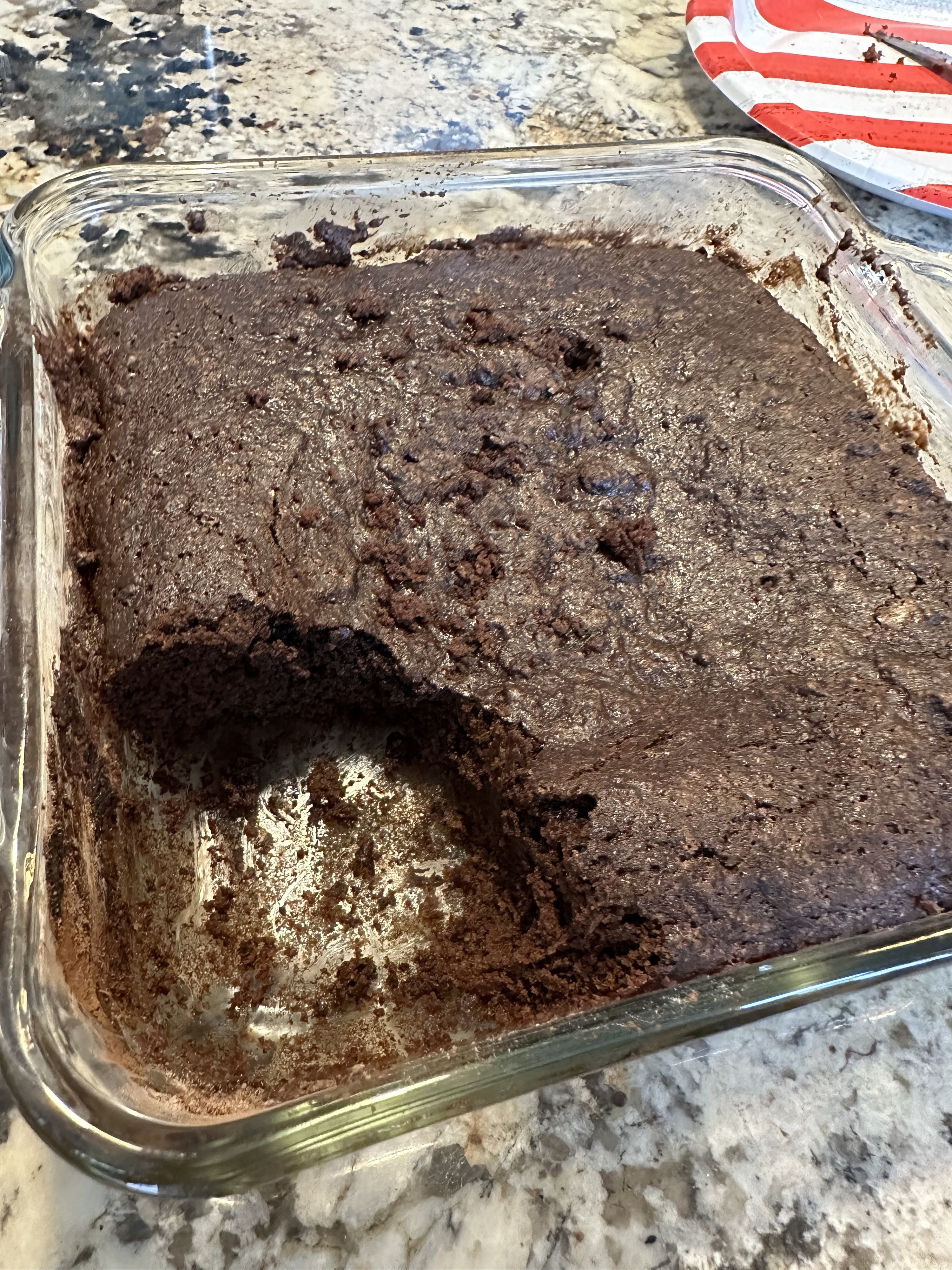 a corner of the cake missing from its pan