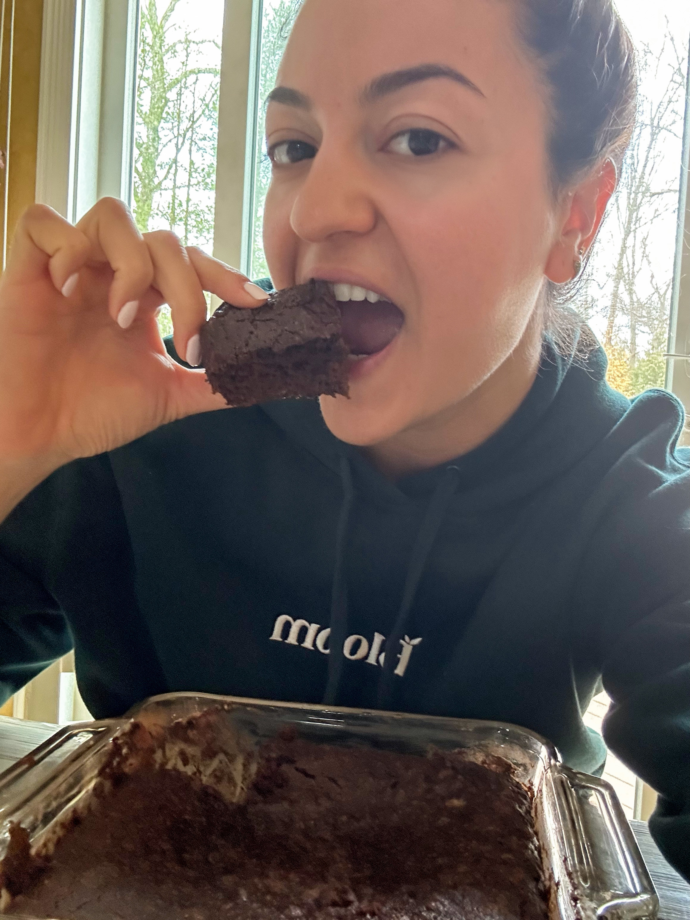 the author taking a bite of the cake