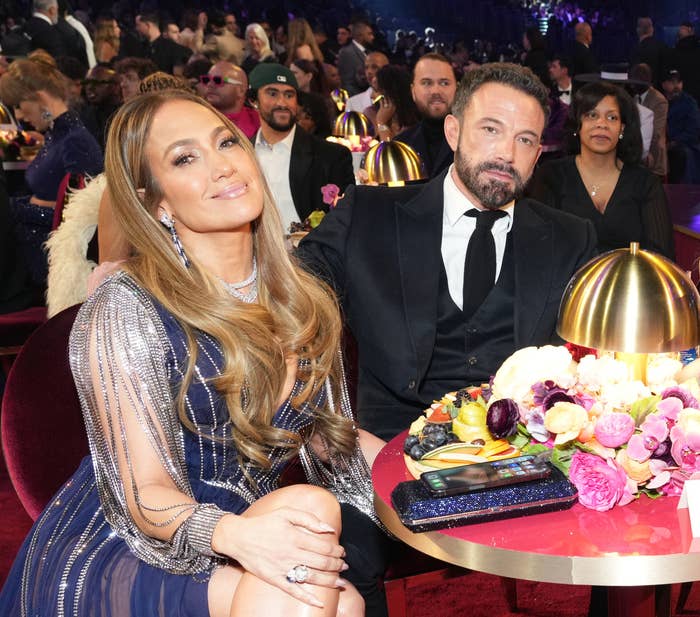 The couple sitting at their table during the Grammys