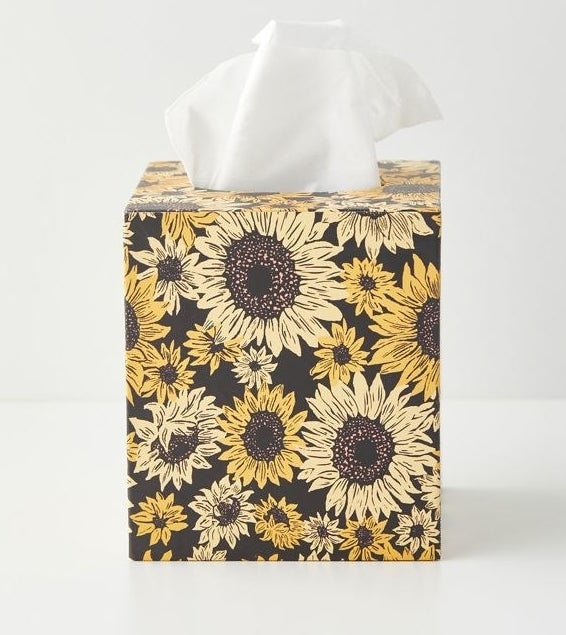 a tissue box holder with a cute sunflower pattern all over it