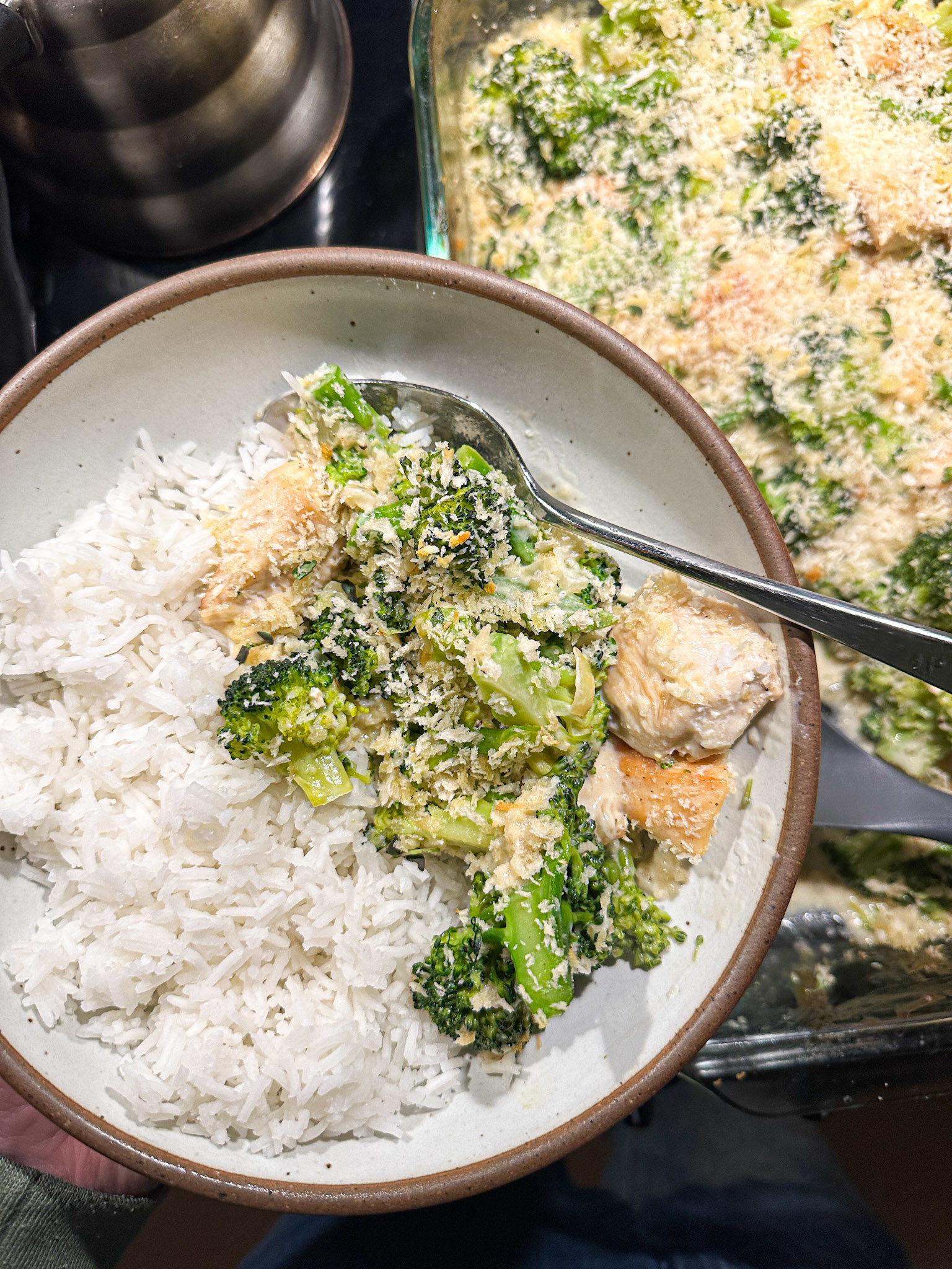 Chicken and broccoli casserole served alongside rice