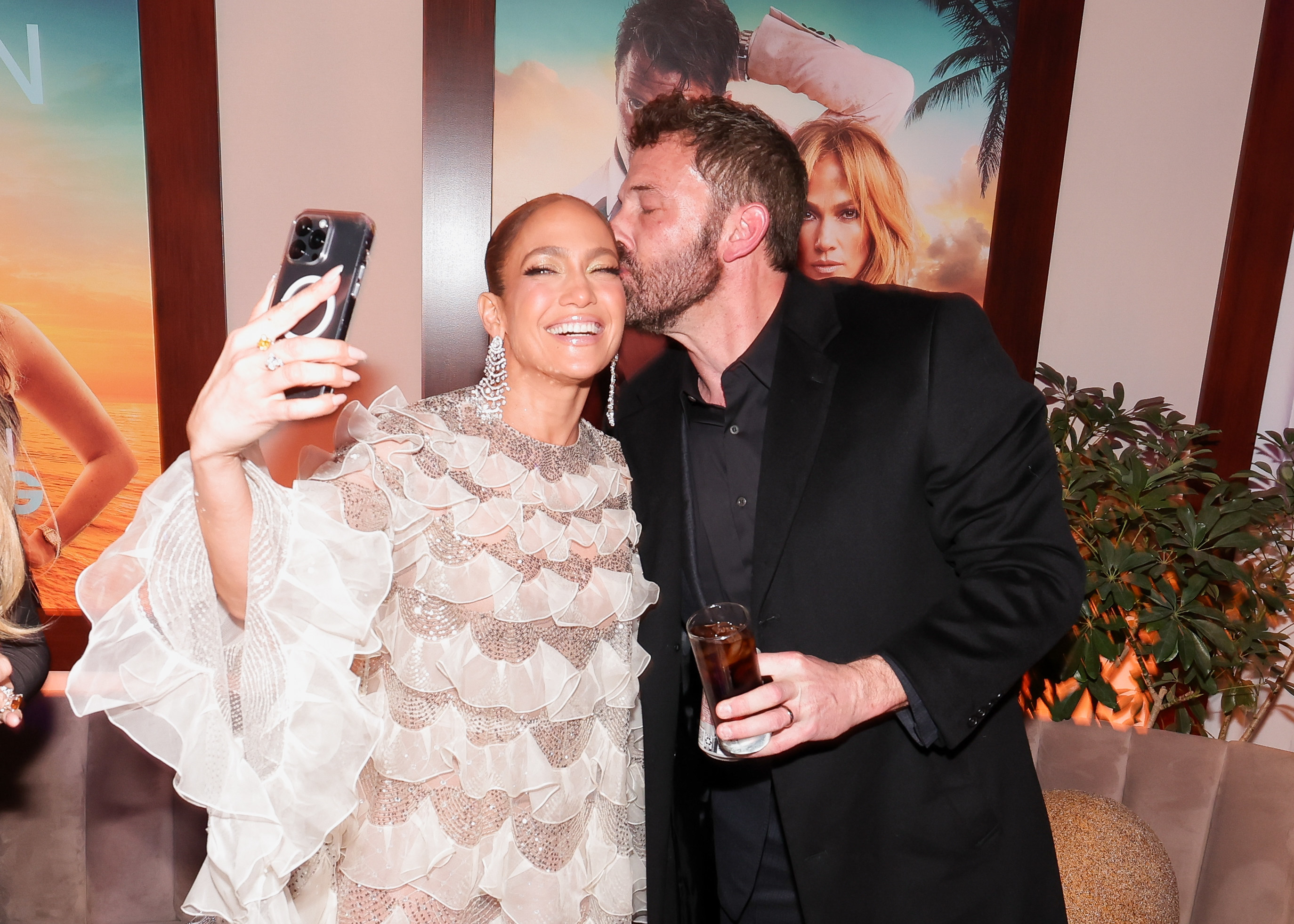 Ben kisses Jennifer on the cheek as she take a selfie