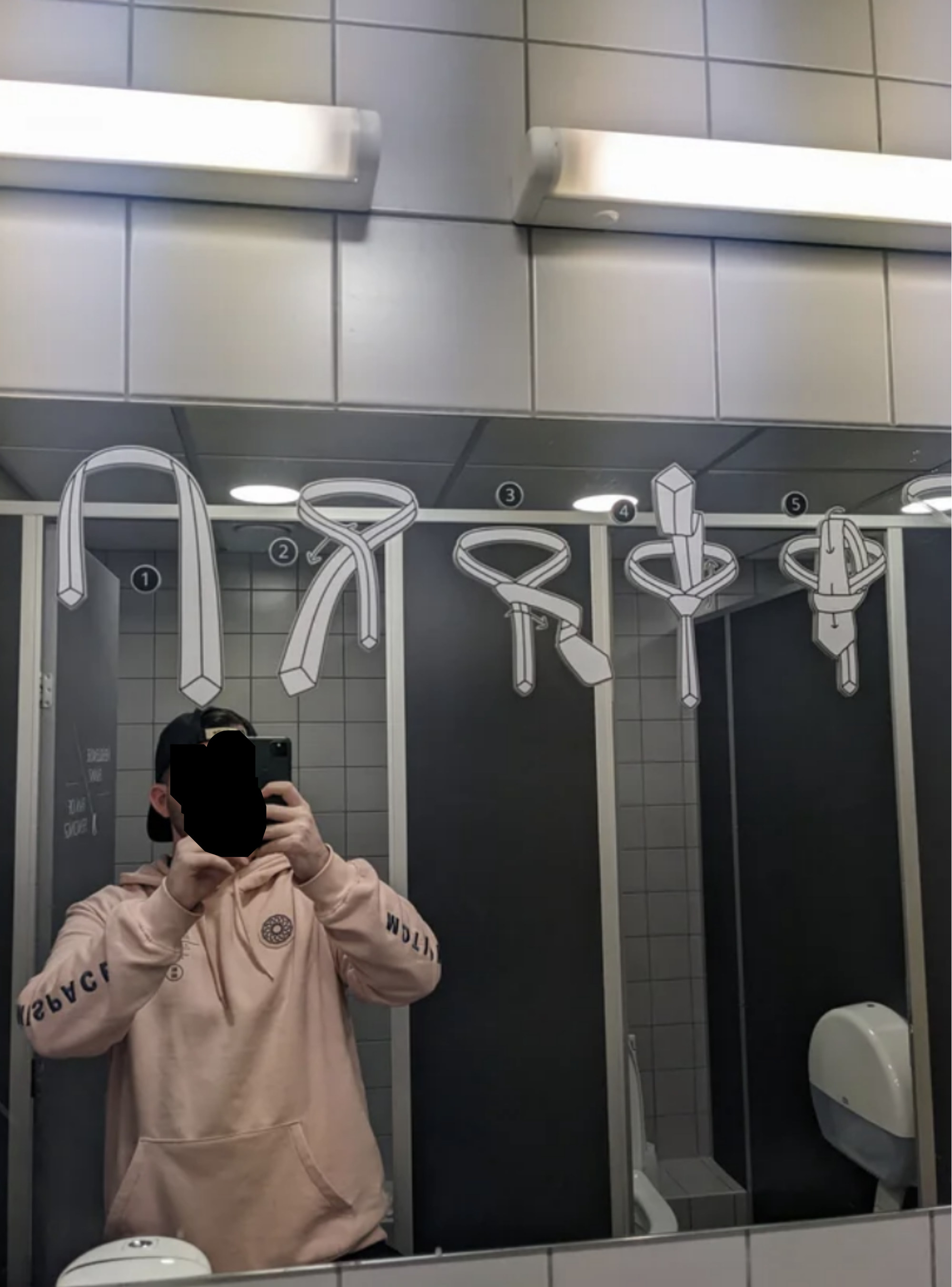 Instructions on how to tie a tie on a bathroom mirror