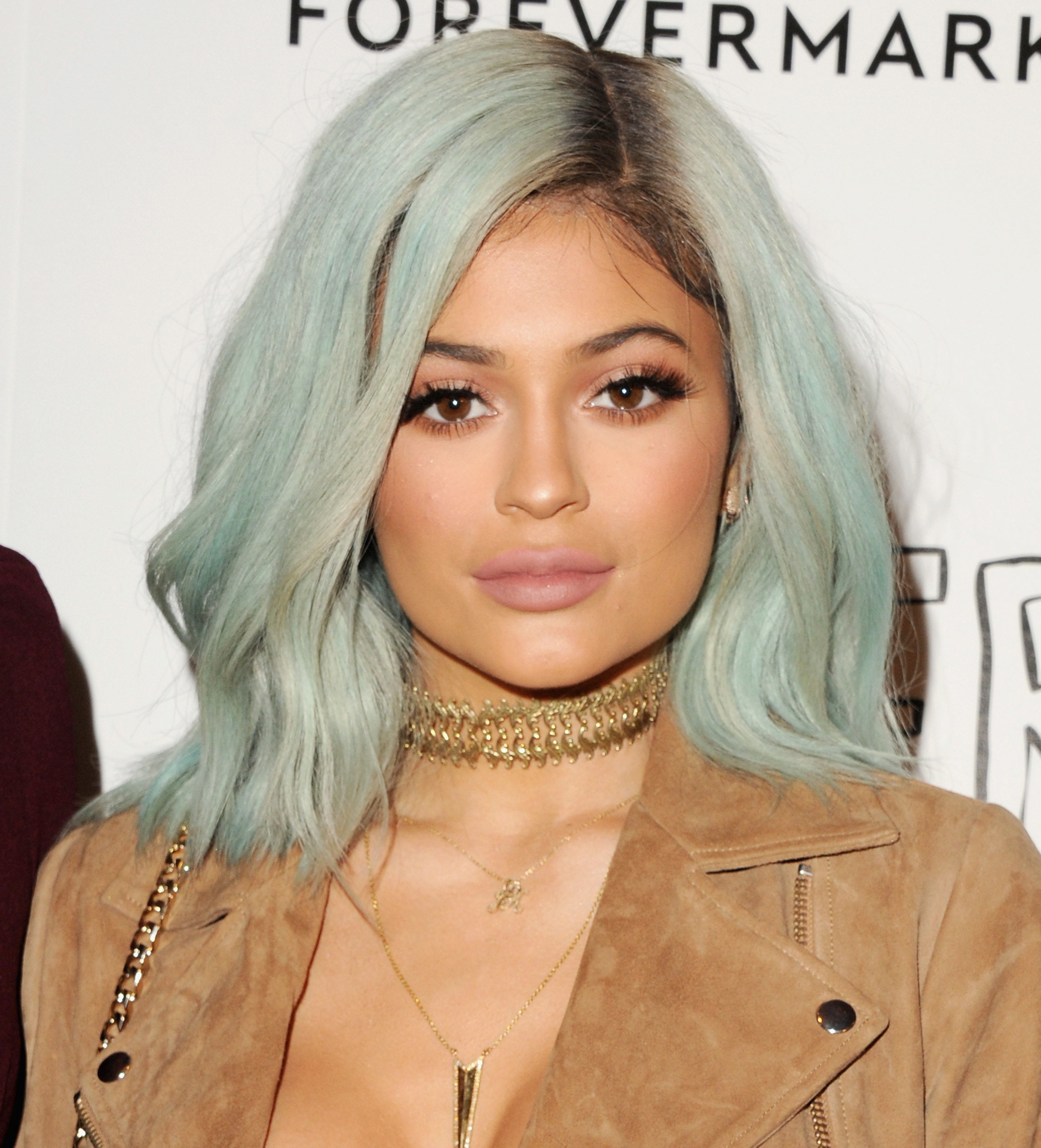 Kylie with shoulder length pastel blue green hair
