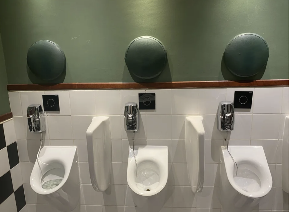 Cushions above the urinals