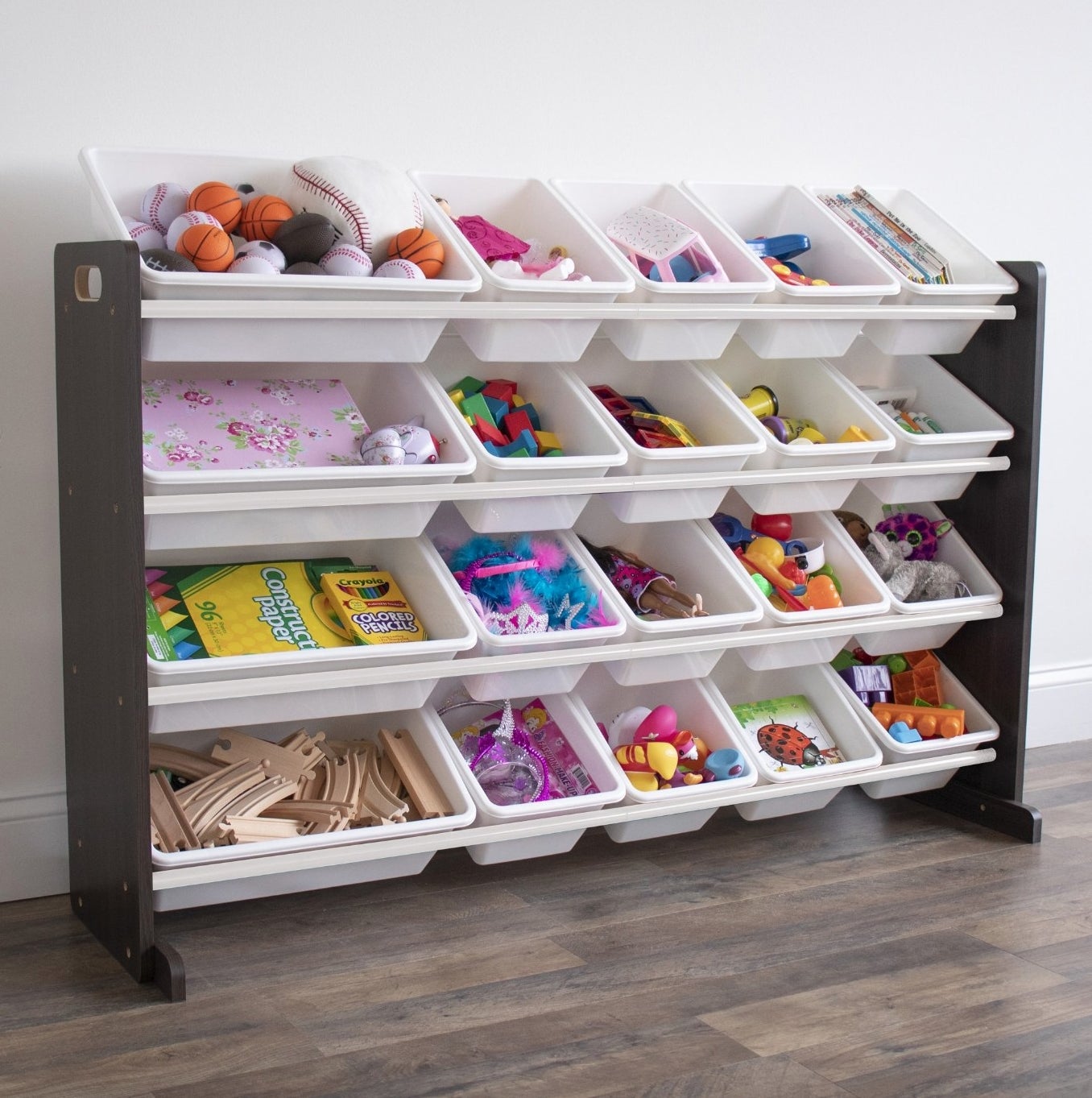 the white and dark brown organizer with all the bins filled with brightly colored toys