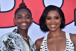 Zaya Wade and Gabrielle Union stand close to each other and smile straight ahead for a photo