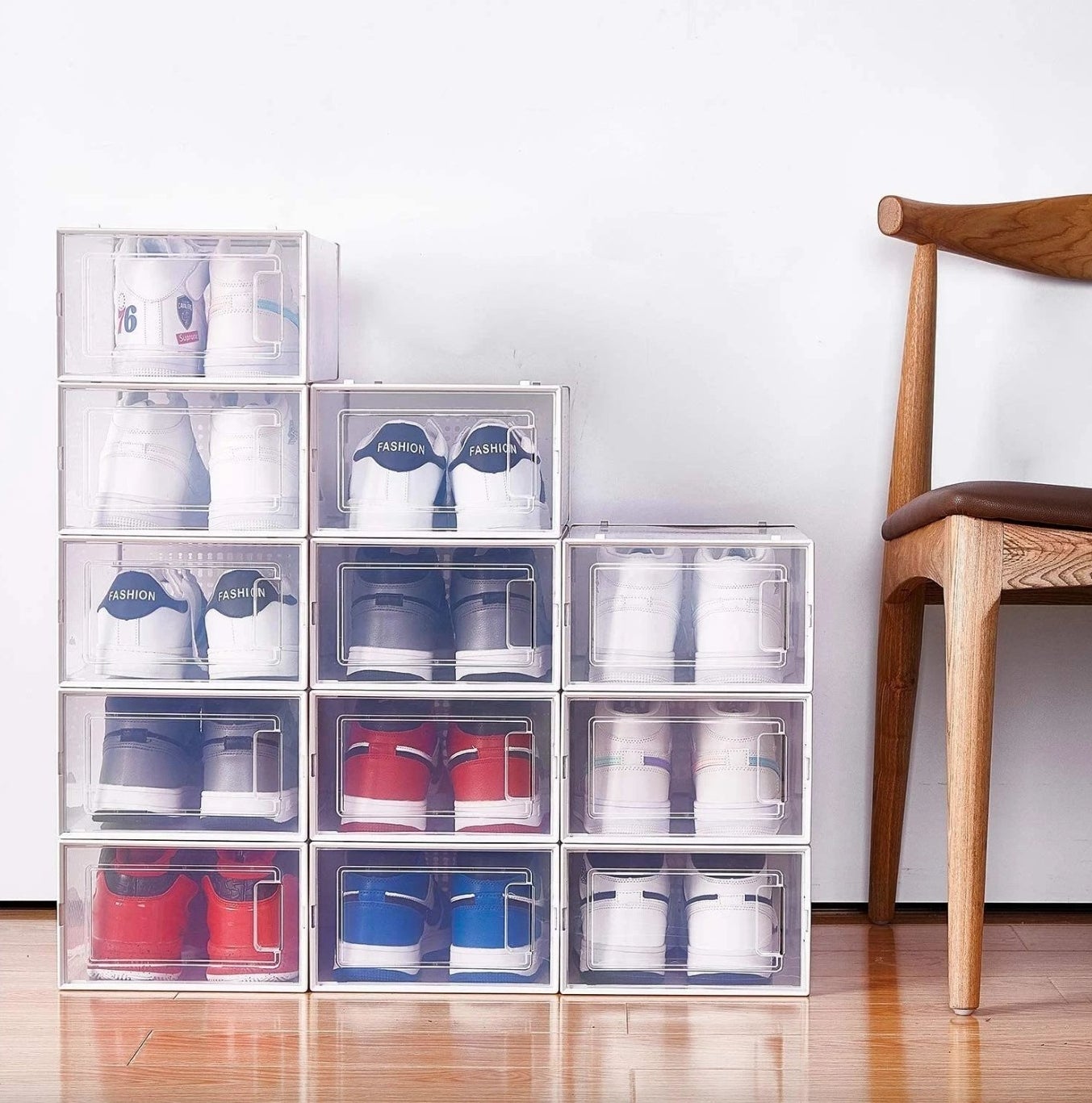 the clear stackable shoe bins with many sneakers inside