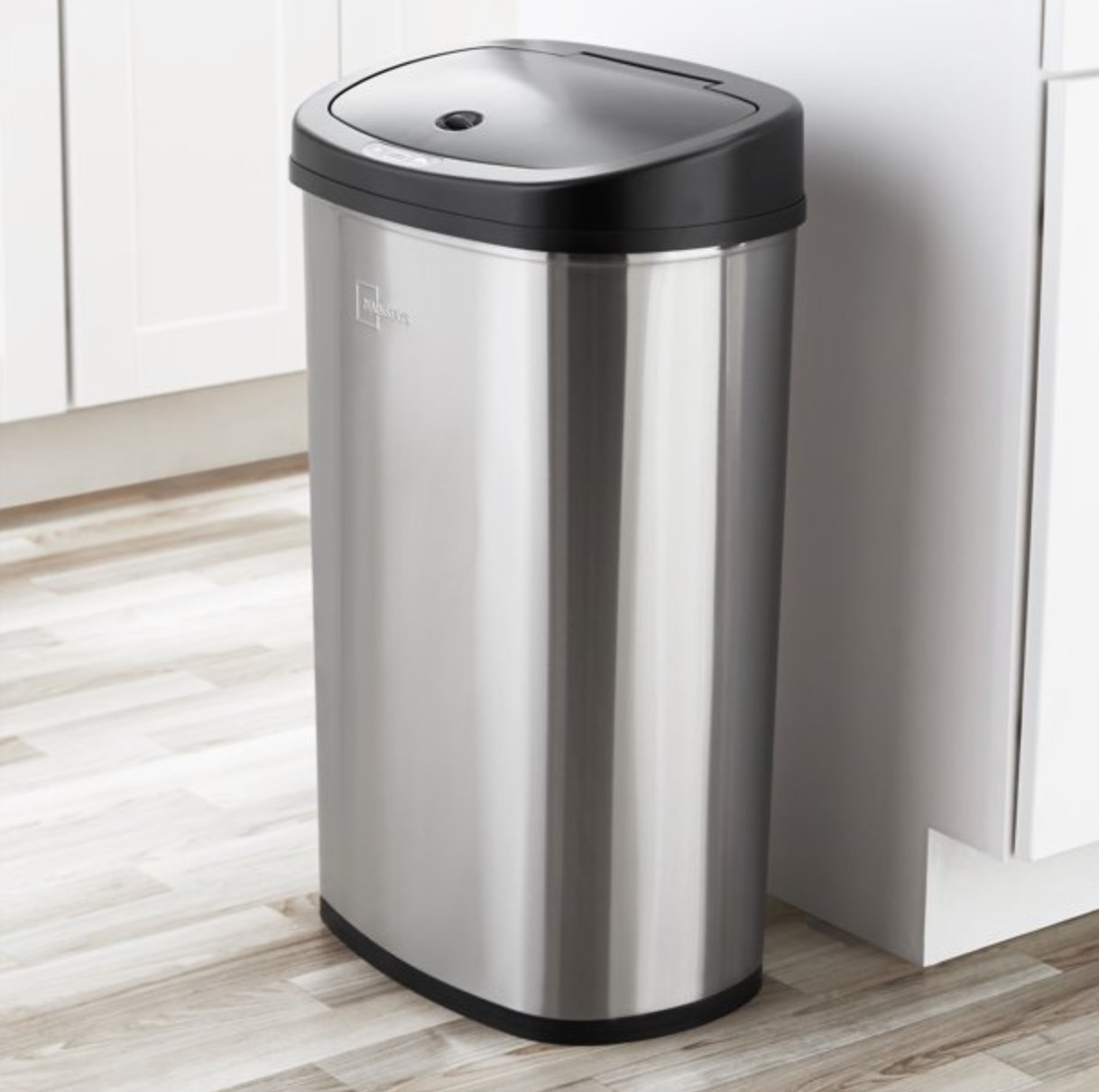 the silver trash can in a kitchen space