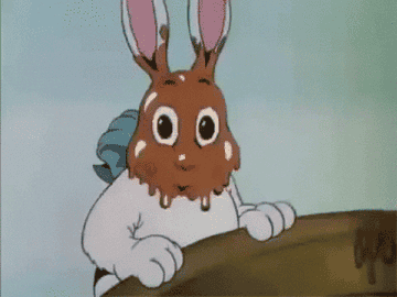 gif of animated rabbit licking chocolate off its own face