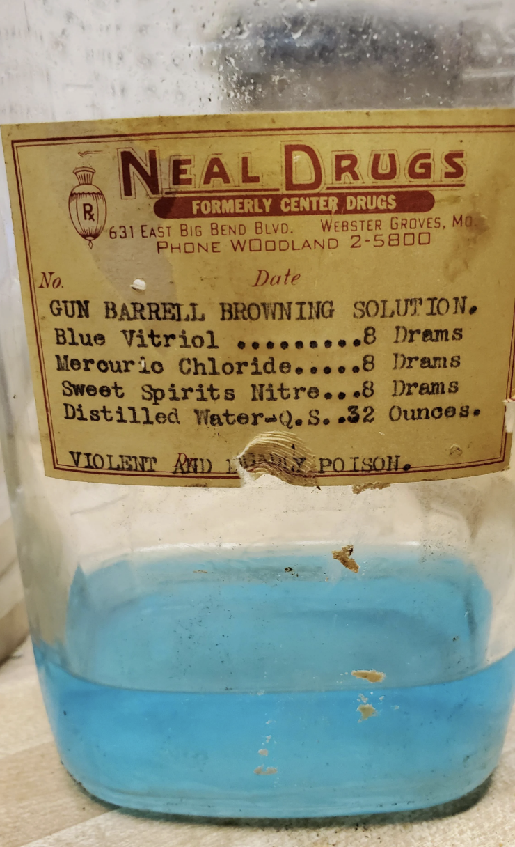 neal drugs bottle with some liquid still inside