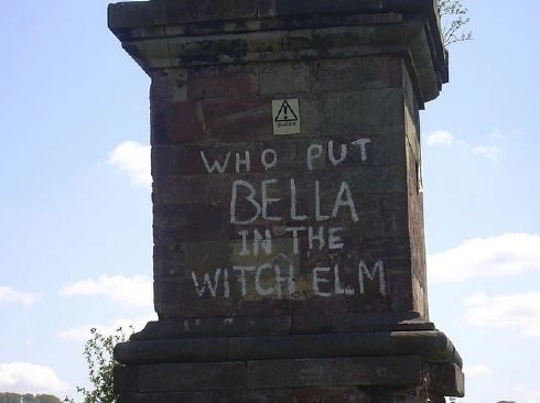 Graffiti on an obelisk that says who put bella in the witch elm