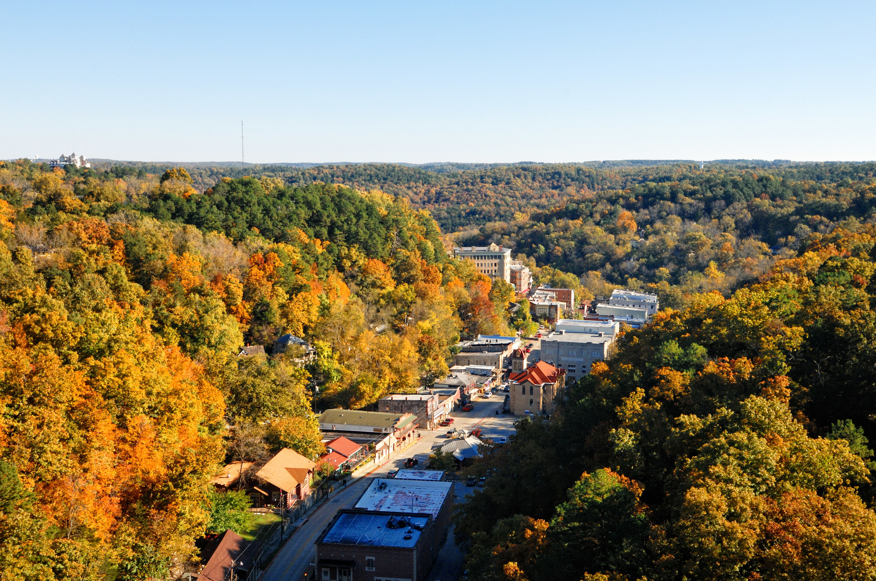 An overhead view of Eureka Springs and the surrounding lush woods in the Fall
