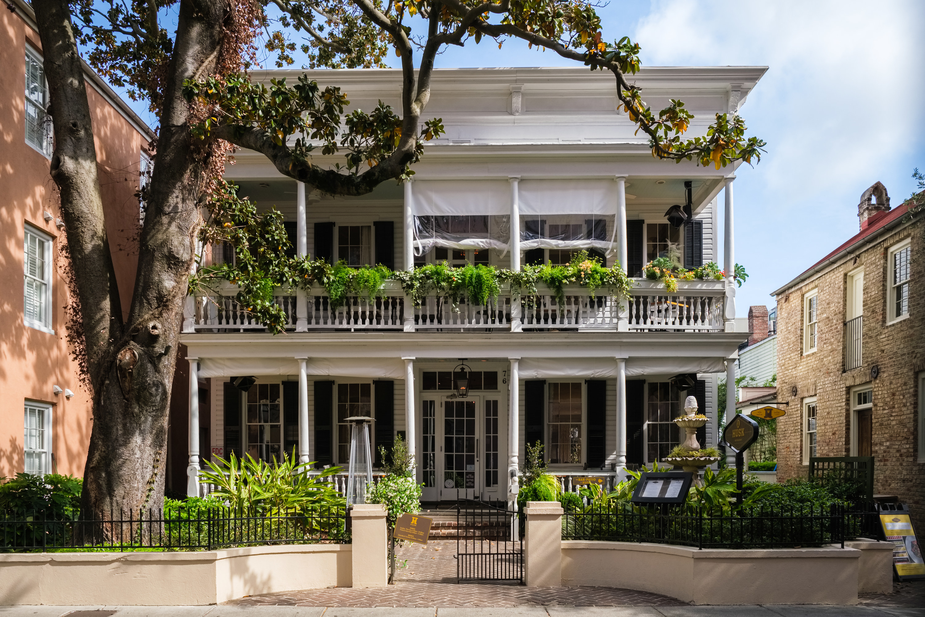 House with big porch and ferns