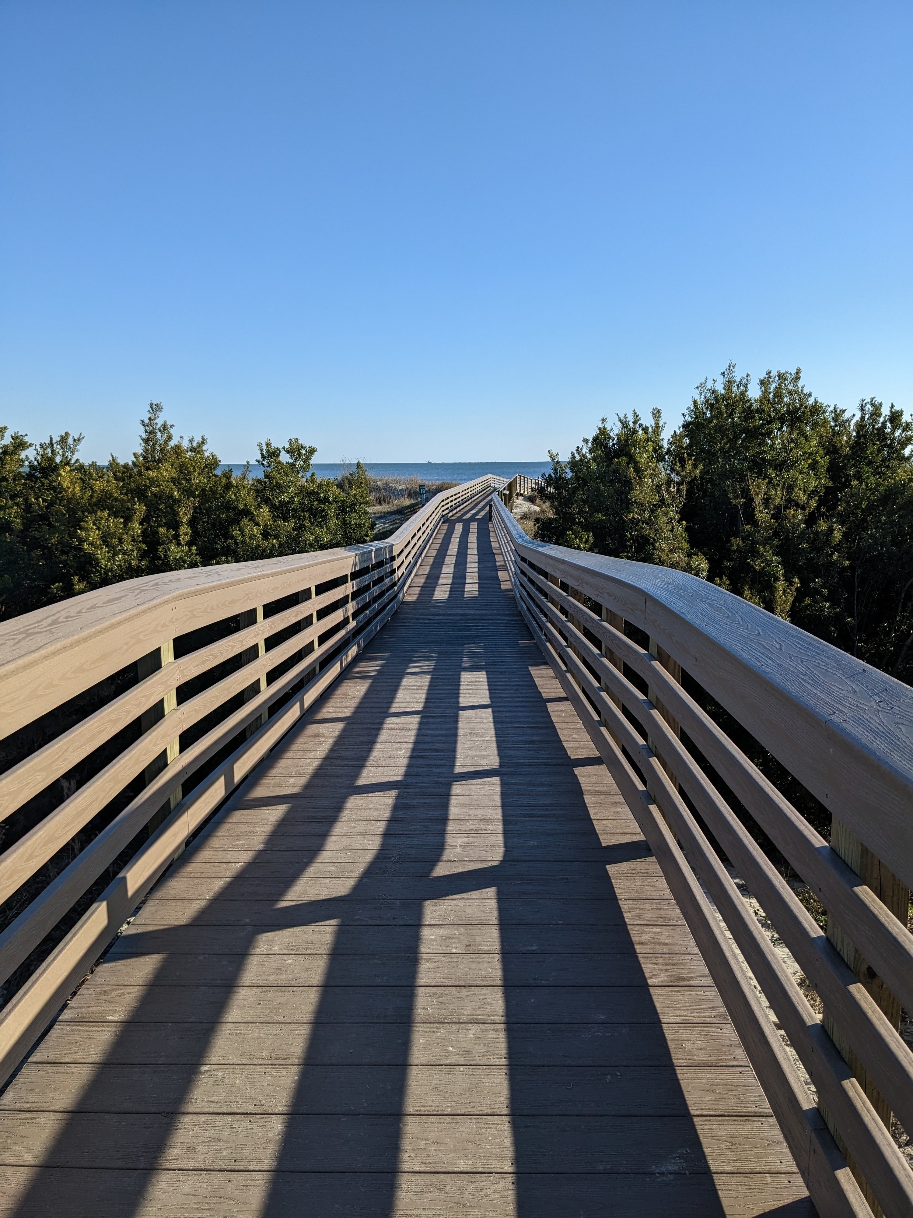 Long boardwalk leading to ocean