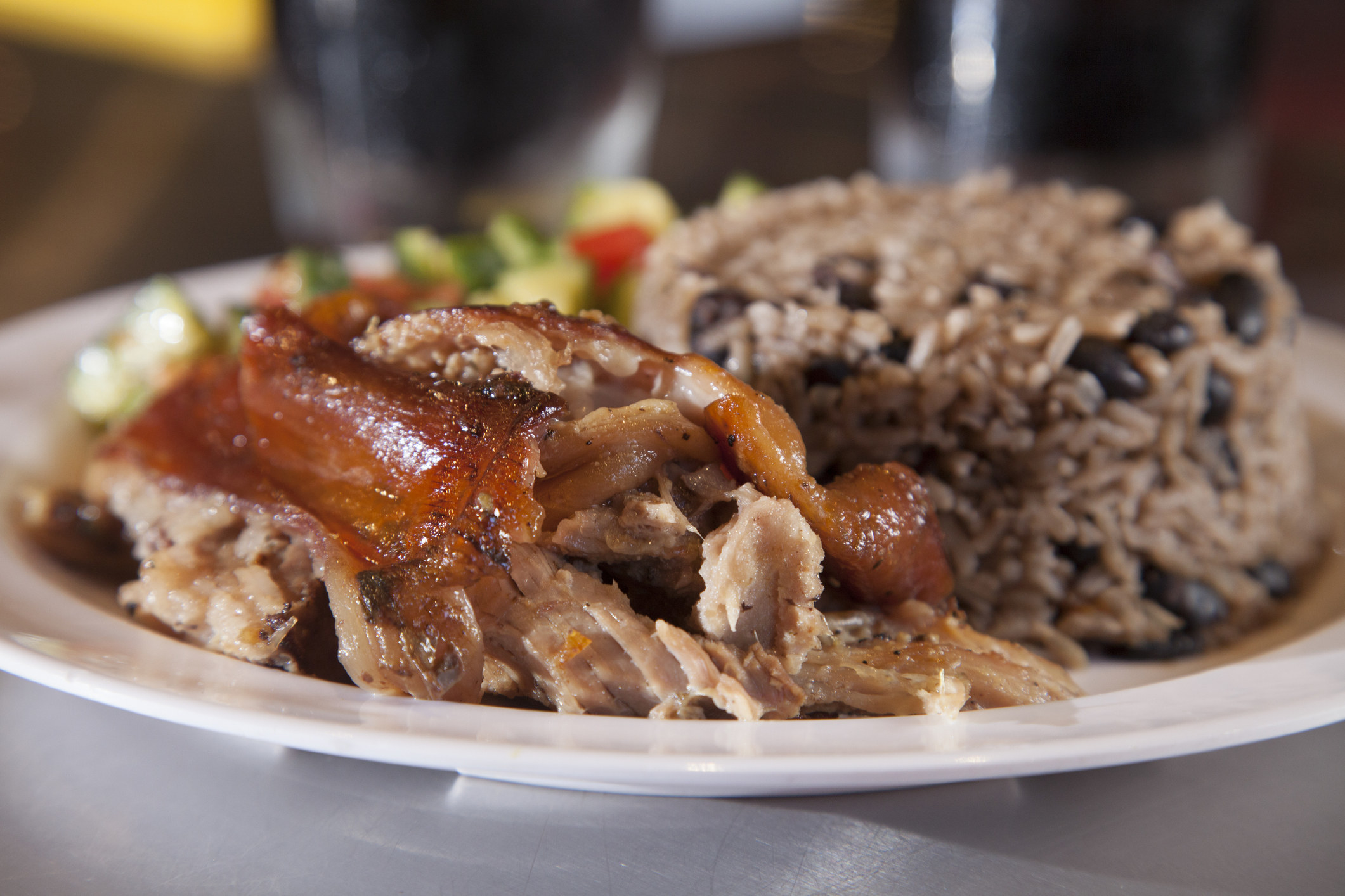 Pork and rice on a plate.