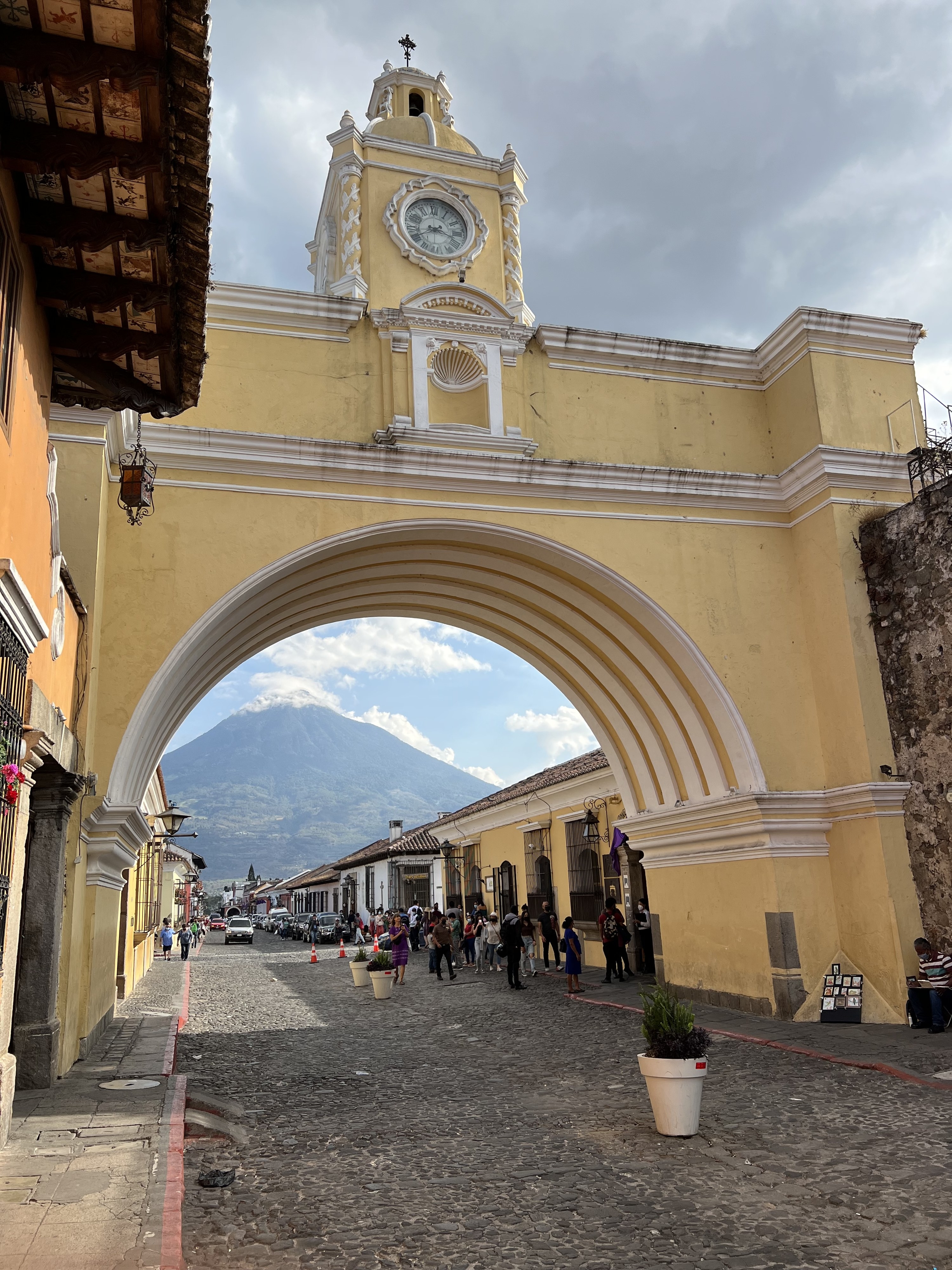 Arch on street with mountain in background