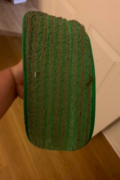 A reviewer's used pad looking very dirty and having collected lots of dust