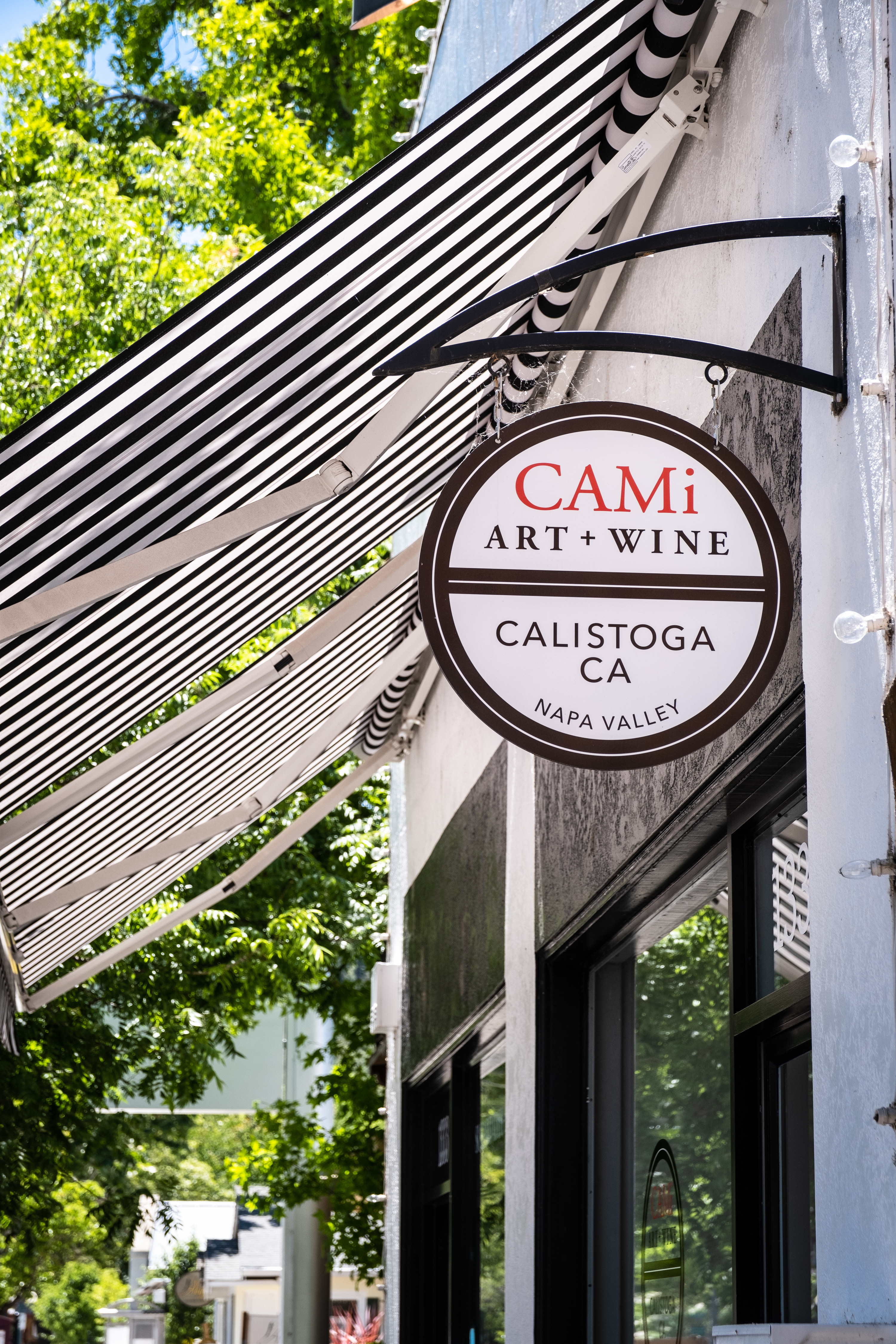 Shop with a sign that says &quot;Cami Art + Wine, Calistoga California&quot;