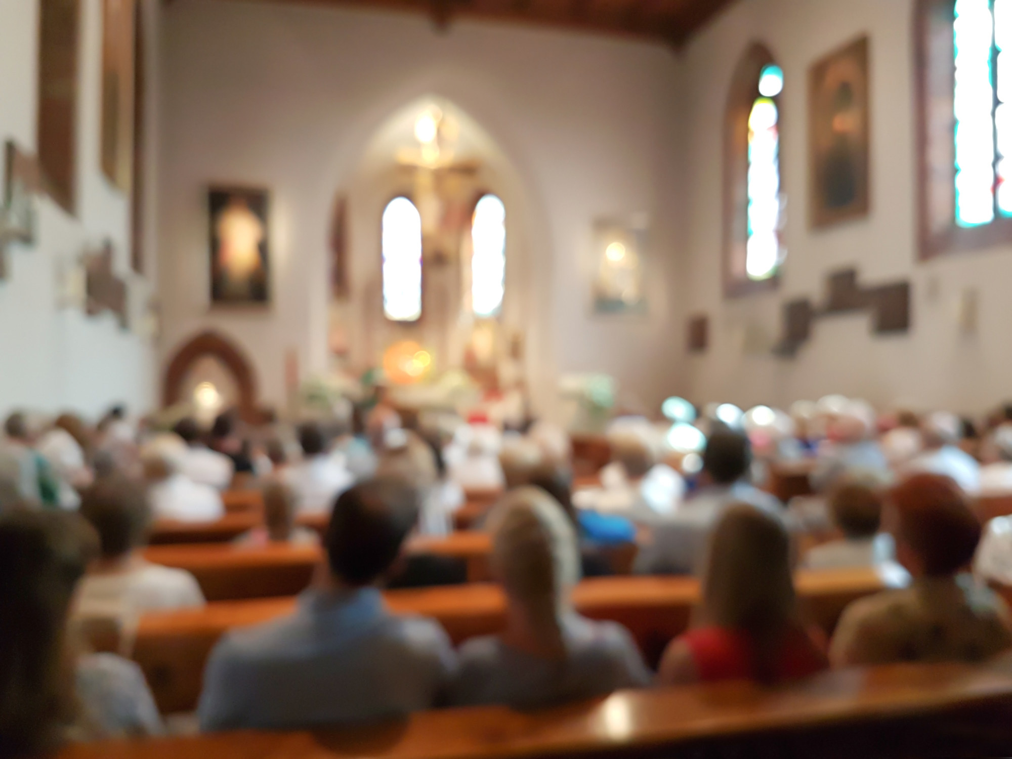 blurry photo of people at a church