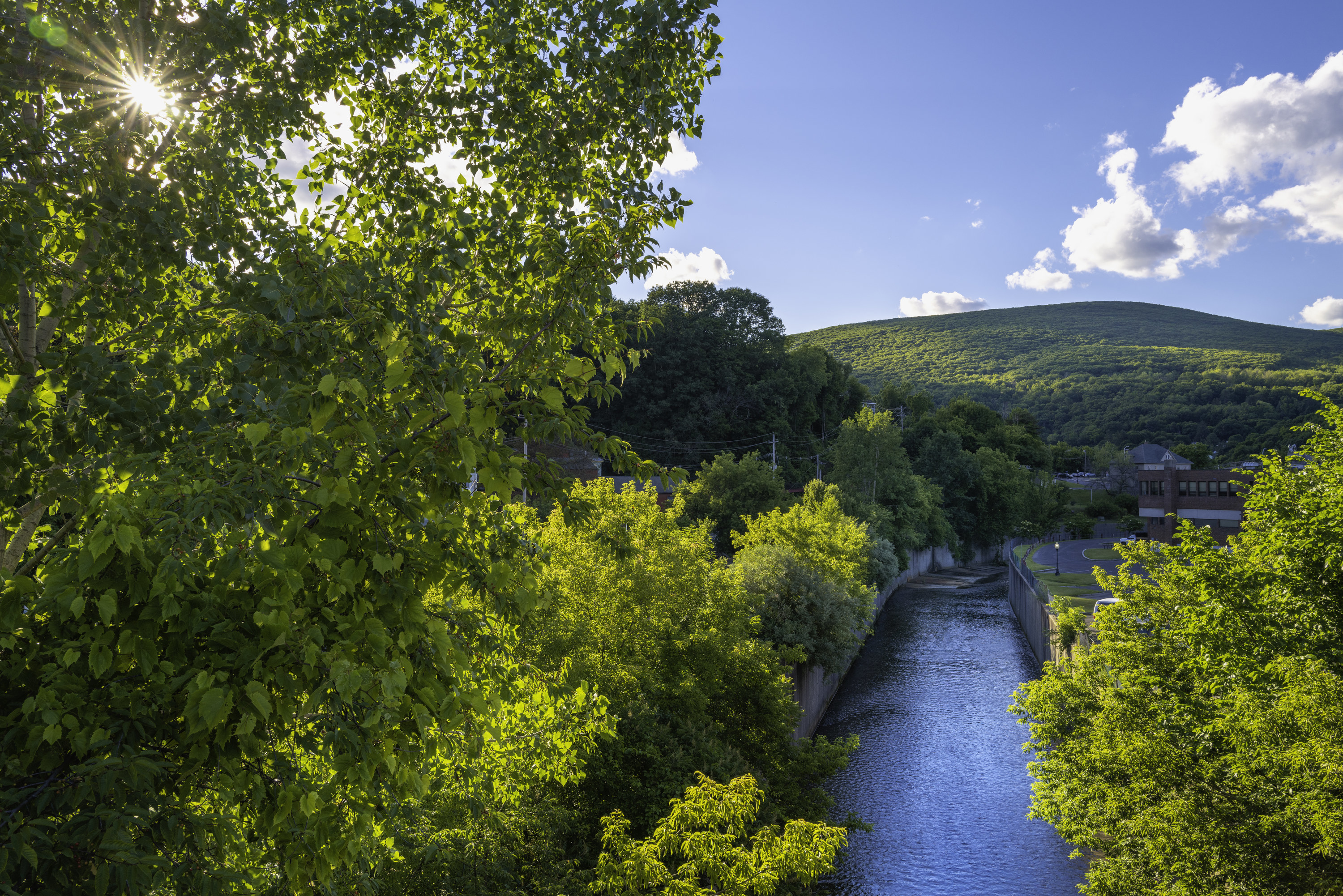 Sunset landscape over the Hoosic River with the view of Green Mountain in North Adams, Massachusetts.