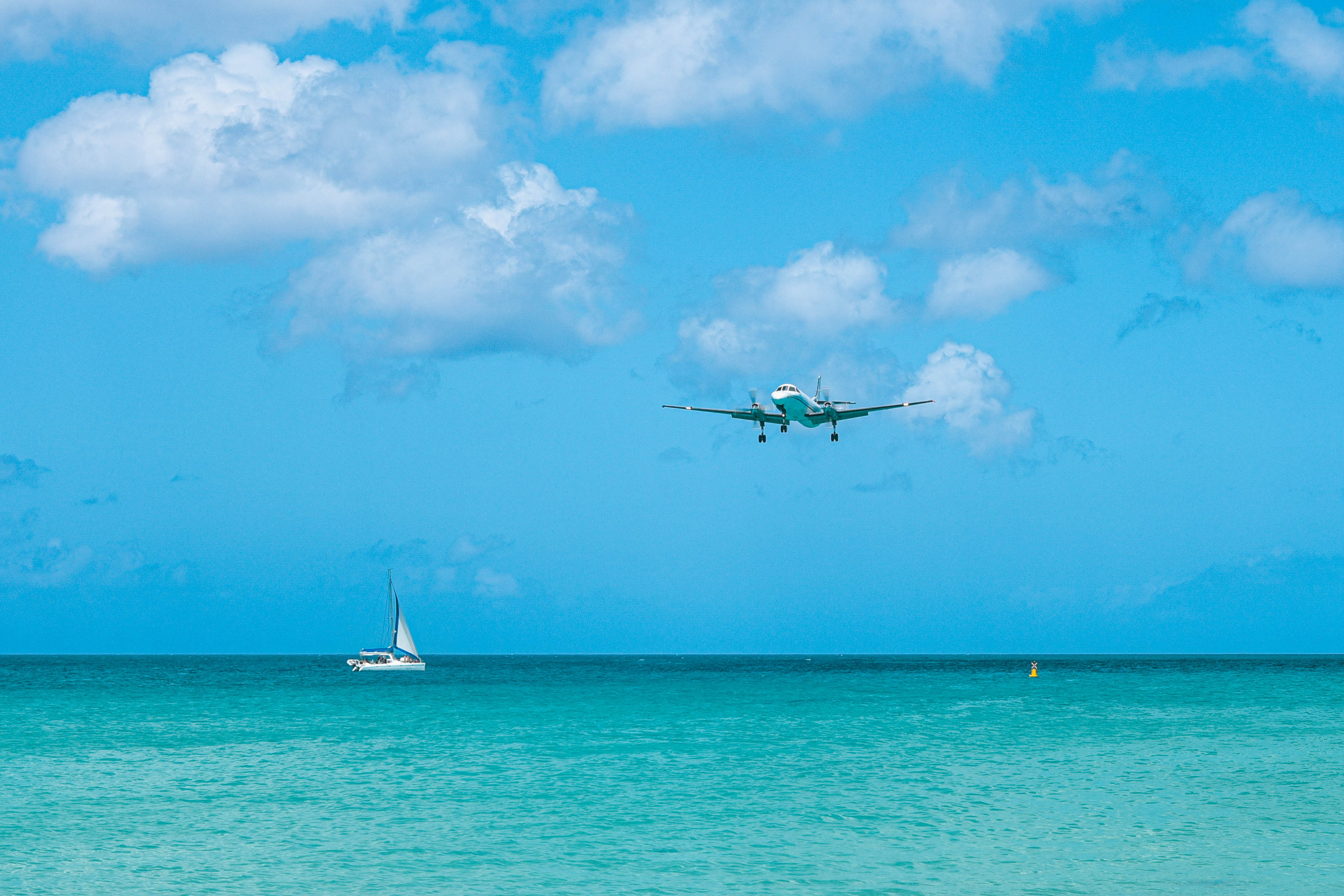 Plane landing on a small Caribbean island