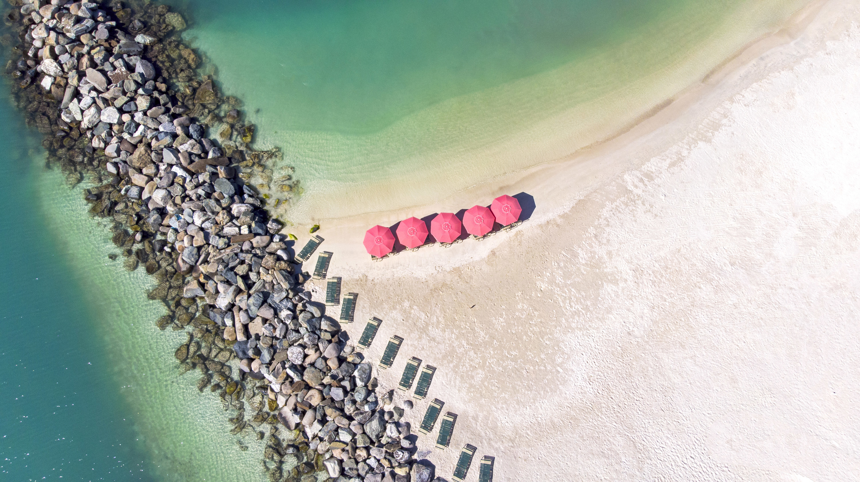 Aerial view of parasol and su beds on the sandy beach in St Maarten