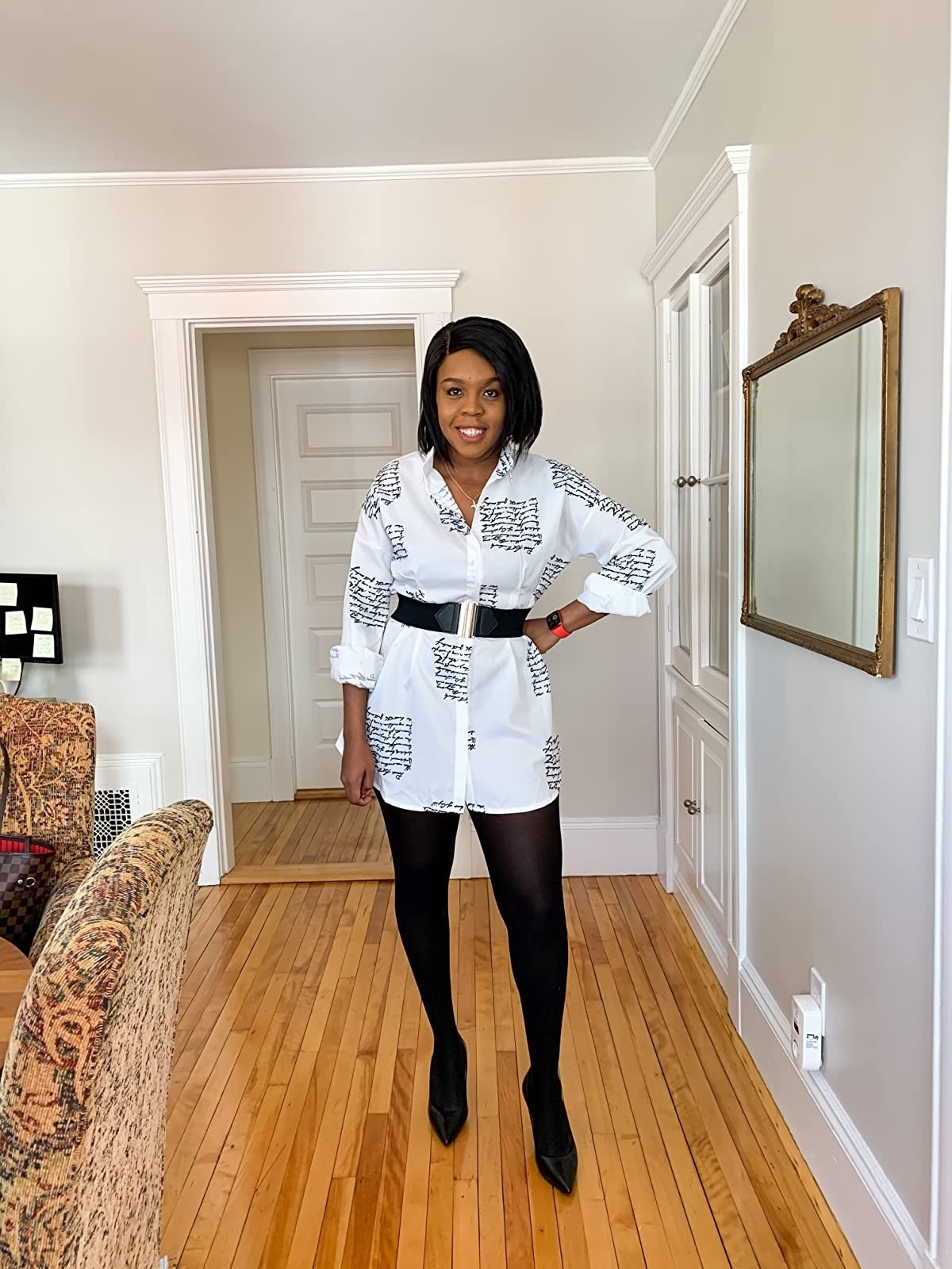 reviewer wearing long sleeve white button down shirt dress with black tights