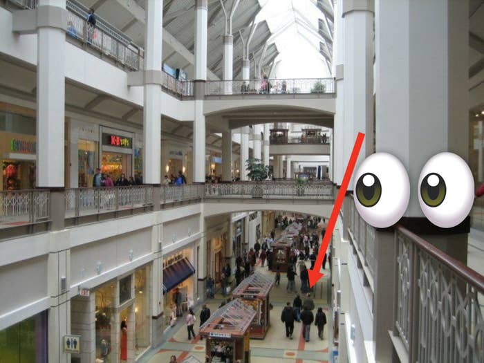 Wide shot of a multi-story mall with carpet