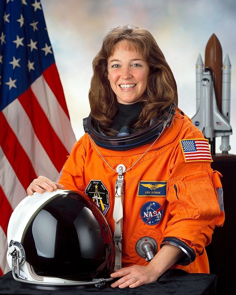Nowak smiling in her astronaut uniform