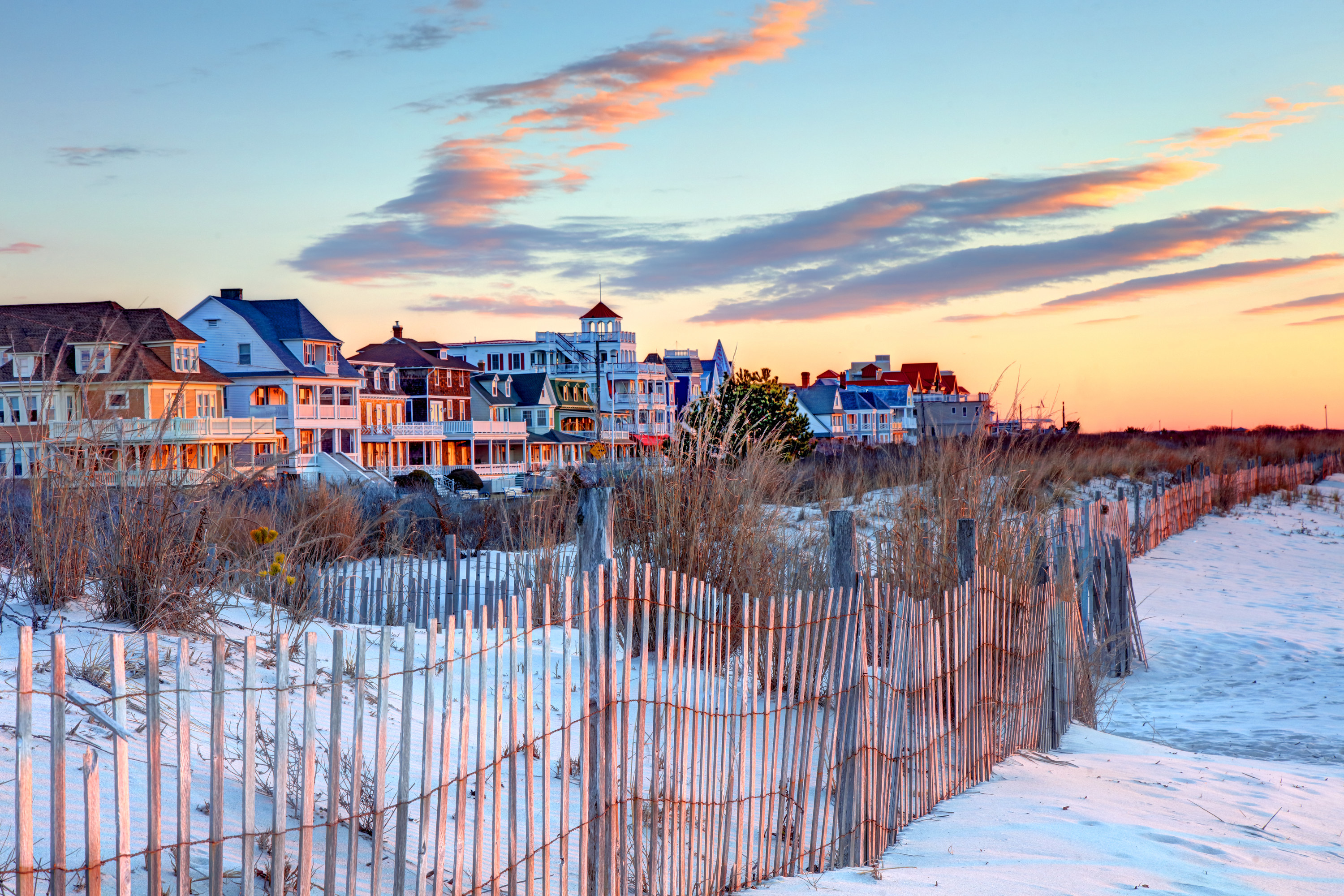 Beach dune and houses in cape may, NJ at sunset