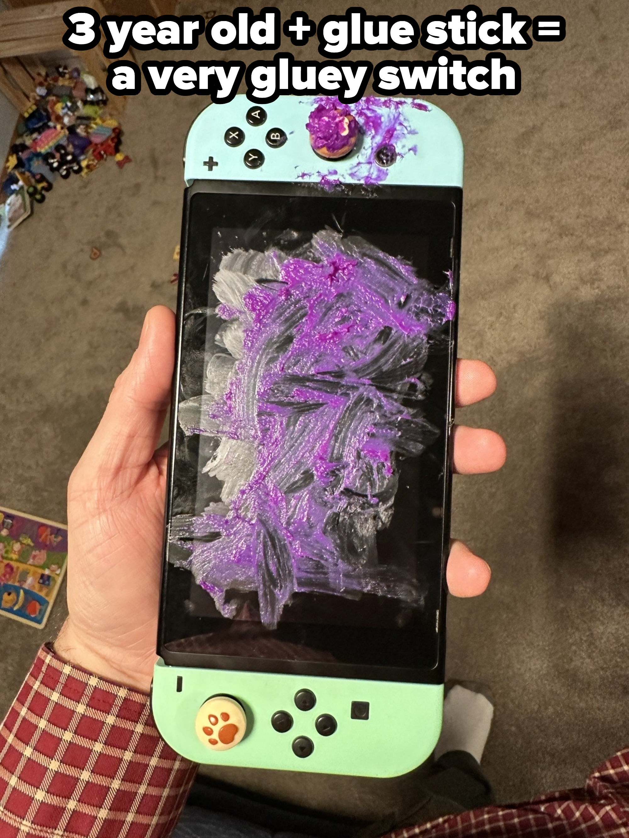 A gaming system covered in paint