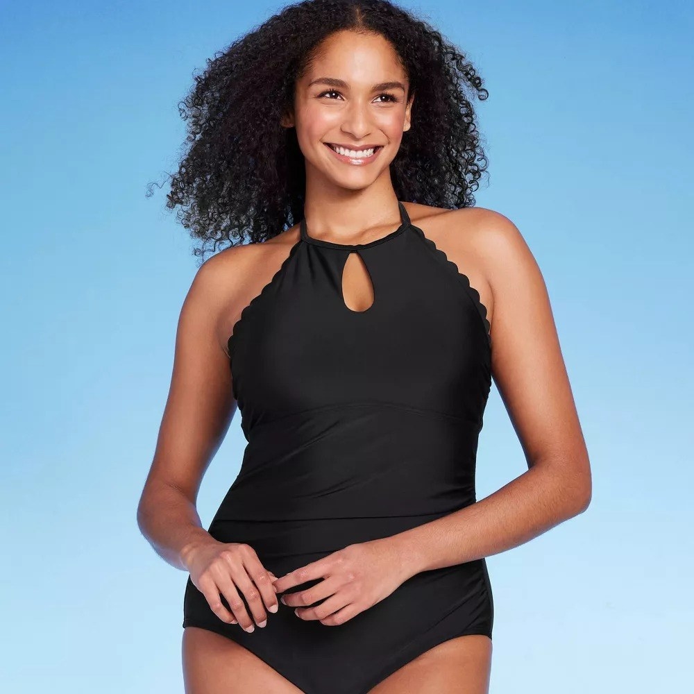 Image of model wearing black bathing suit