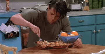 Joey from Friends digging into a casserole