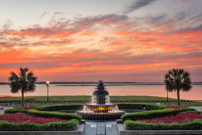 Charleston, South Carolina, USA at Waterfront Park at dawn with hedges, fountain and palm trees