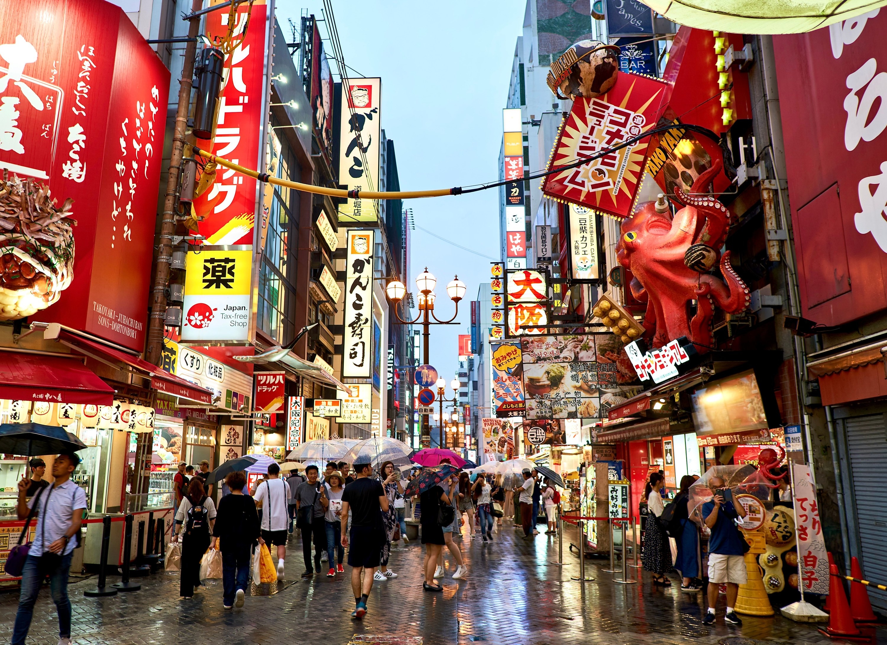 Busy Japanese street with lots of people and stores